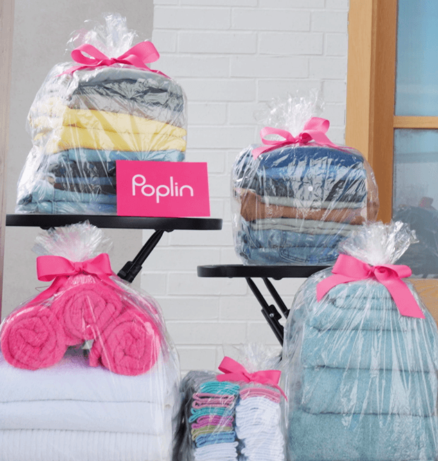 Colorful garments displayed together, representing the everyday clothing that makes up the laundry load at the center of this cost and value comparison