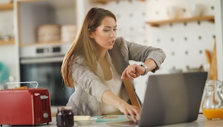 Busy woman multitasking at home, reflecting the reality of a schedule already claimed by things that matter more than laundry